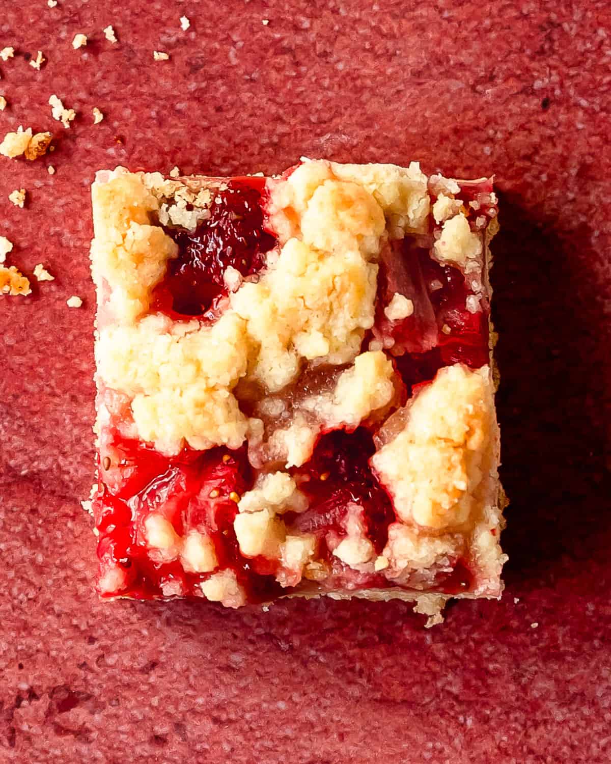 Strawberry bars are wonderfully delicious cookie crumble bars made with a press in shortbread crust, fresh strawberry filling and a buttery crumb topping. These strawberry crumb bars are quick and easy to make using a few simple ingredients. Make this easy strawberry dessert for the the perfect, refreshing treat to enjoy on a hot day.  