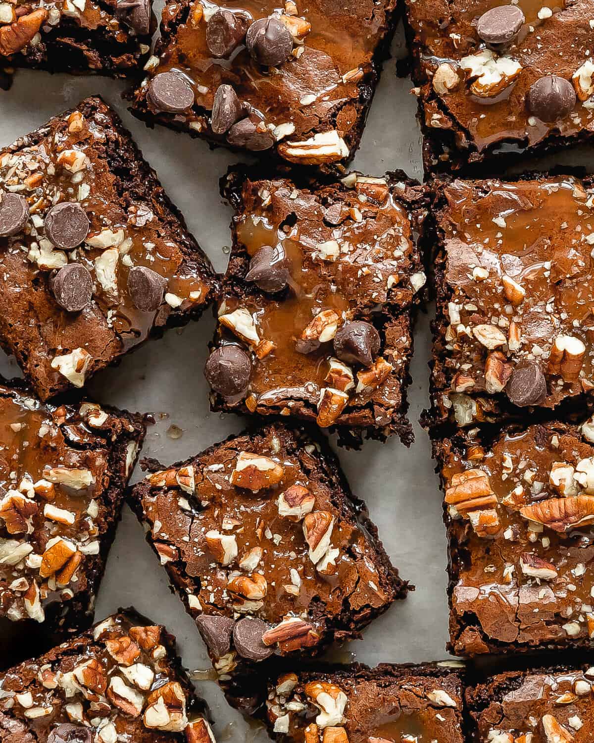 Turtle brownies are rich and fudgy brownies topped with a layer of salted caramel sauce, chopped pecans and sweet chocolate chips. These caramel brownies are the ultimate indulgence and taste just like the turtle candy. 