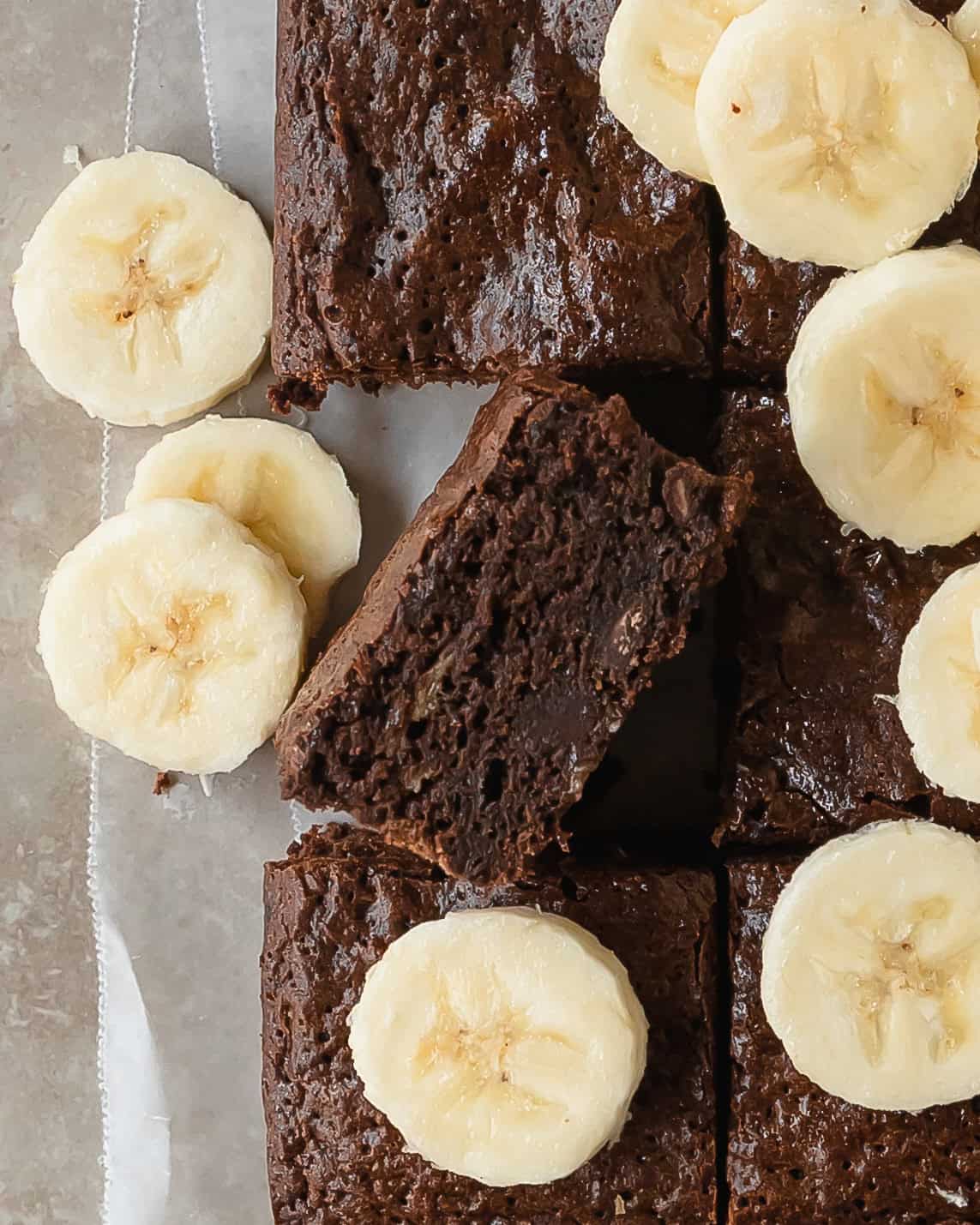 Banana brownies are rich, fudgy and chewy brownies made with creamy bananas. The indulgently deep chocolate flavor of the brownies is perfectly balanced with the subtle sweetness of ripe bananas and chocolate chips.  These banana flavored brownies are easy to make and are the perfect treat.  