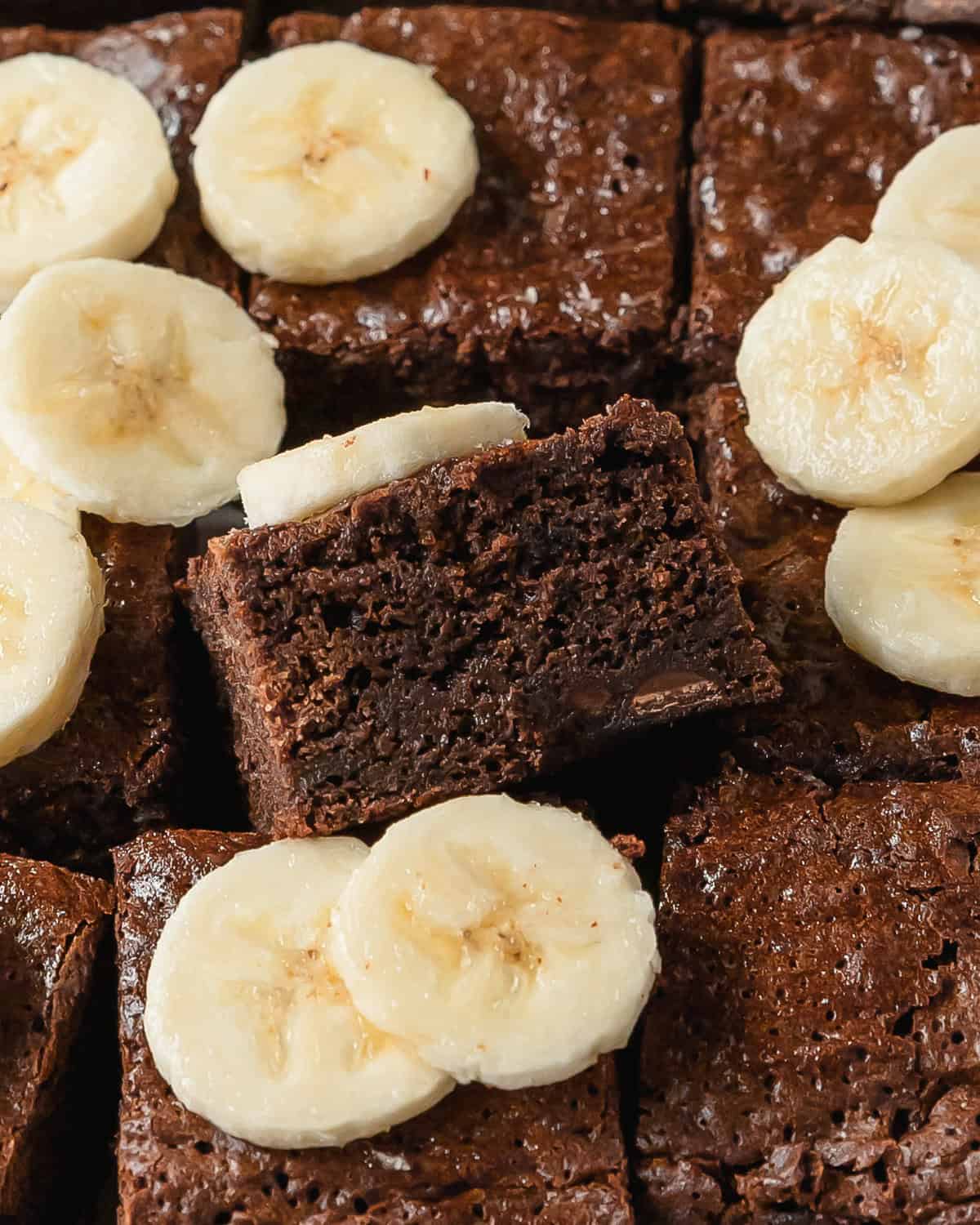 Banana brownies are rich, fudgy and chewy brownies made with creamy bananas. The indulgently deep chocolate flavor of the brownies is perfectly balanced with the subtle sweetness of ripe bananas and chocolate chips.  These banana flavored brownies are easy to make and are the perfect treat. 