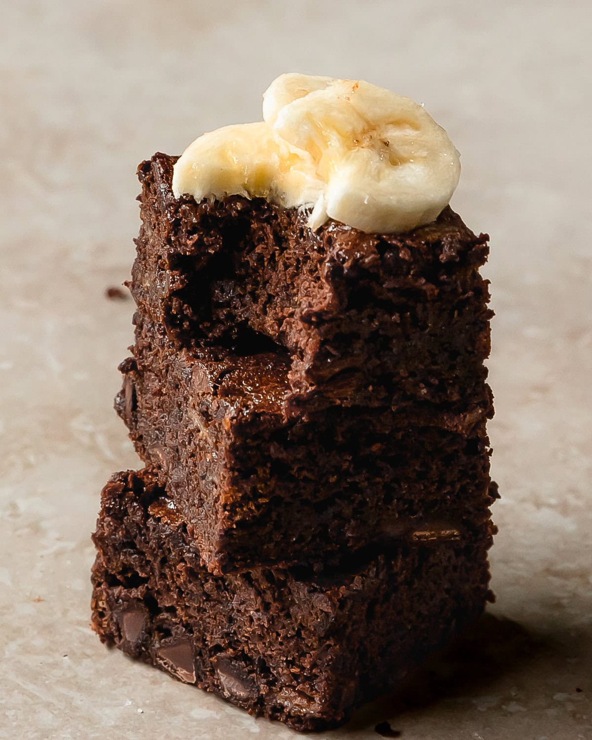 Banana brownies are rich, fudgy and chewy brownies made with creamy bananas. The indulgently deep chocolate flavor of the brownies is perfectly balanced with the subtle sweetness of ripe bananas and chocolate chips.  These banana flavored brownies are easy to make and are the perfect treat.