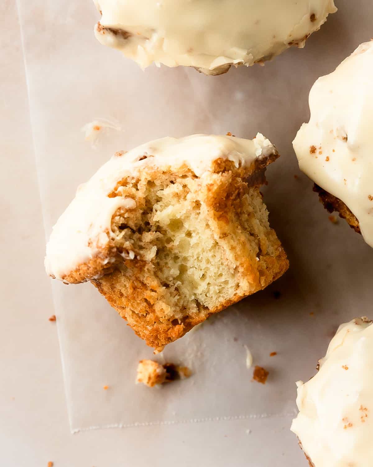 Cinnamon roll muffins are wonderfully soft, light and fluffy no yeast muffins filled with ribbons of sweet cinnamon roll filling.  Once baked, these cute cinnamon rolls muffins are topped with a sweet and tangy cream cheese glaze. These cinnamon bun muffins are quick, easy to make and muffins are perfect for breakfasts or snacks.