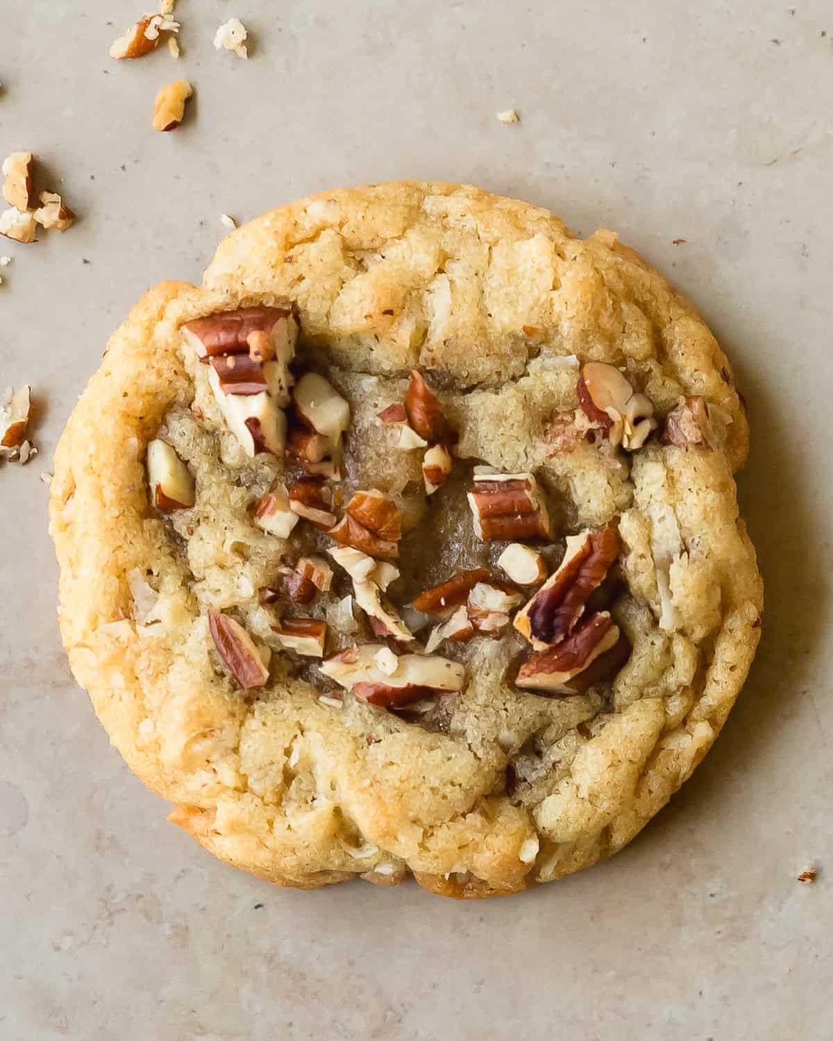 Coconut pecan cookies are soft, chewy and buttery sugar cookies filled with shredded coconut and toasted pecans. What I love most about this coconut pecan cookie recipe is that it’s almost no chill and is easy to make in one bowl. These pecan coconut cookies are the perfect cozy cookie to enjoy all year.