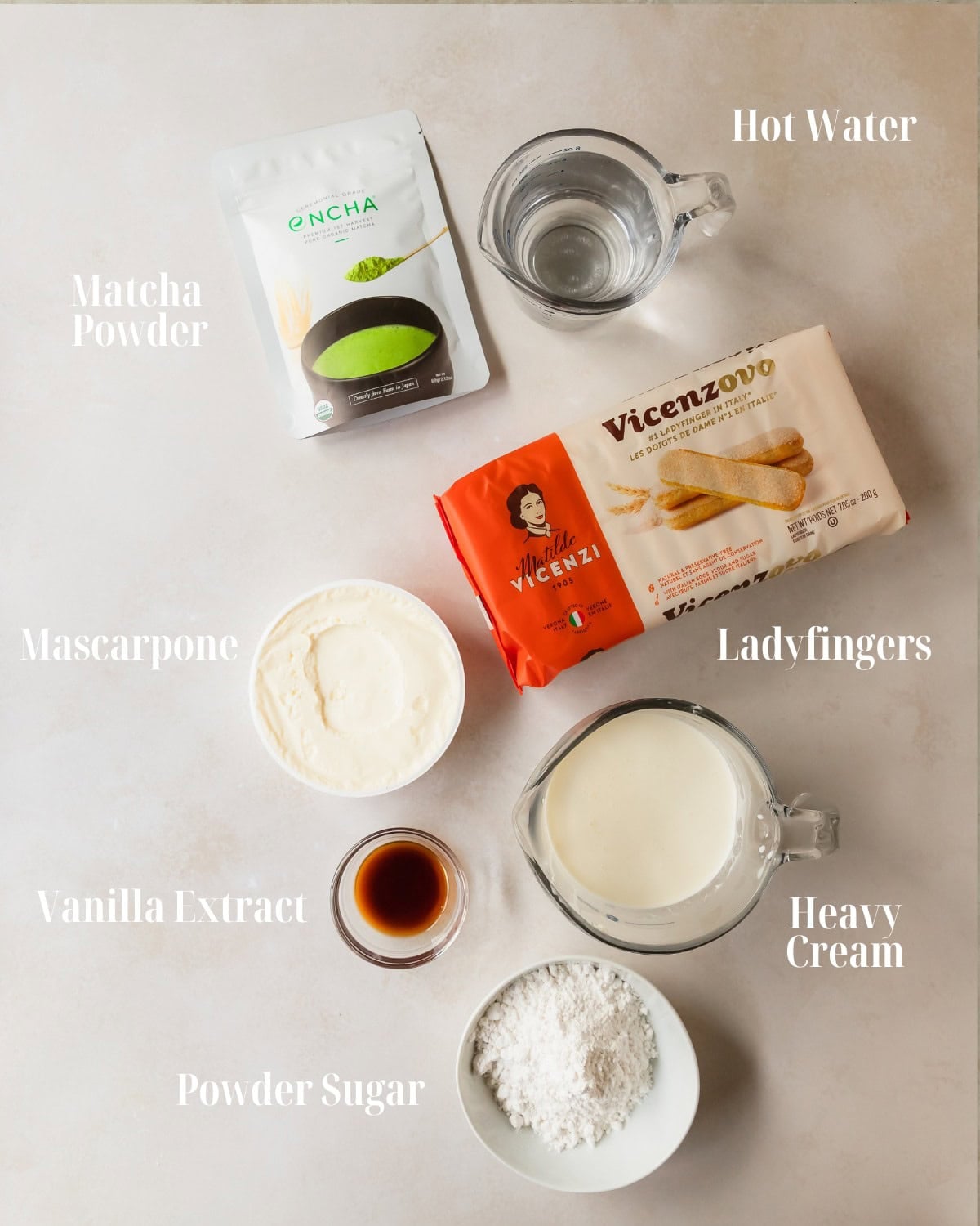 Gather brewed matcha powder, hot water, ladyfingers, mascarpone, heavy cream, powered sugar and vanilla extract.