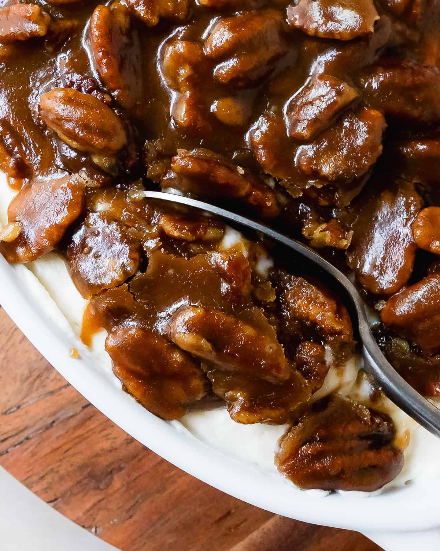 Pecan pie dip is a rich and creamy no bake cheesecake dip topped with gooey and crunchy pecan pie filling. This pecan pie dip recipe is quick and easy to make. It’s the perfect dessert dip to serve with apples, cookies, crackers or pretzels.