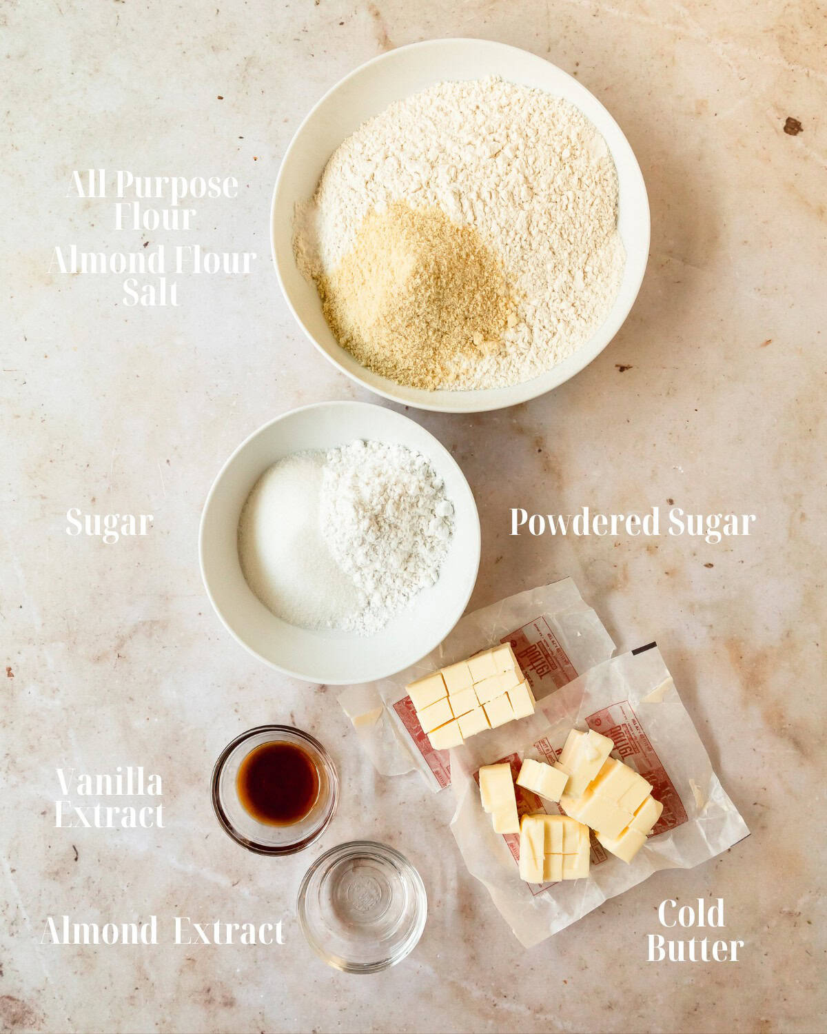 Gather all purpose flour, almond flour, salt, powdered sugar, granulated sugar, vanilla extract, almond extract and butter.