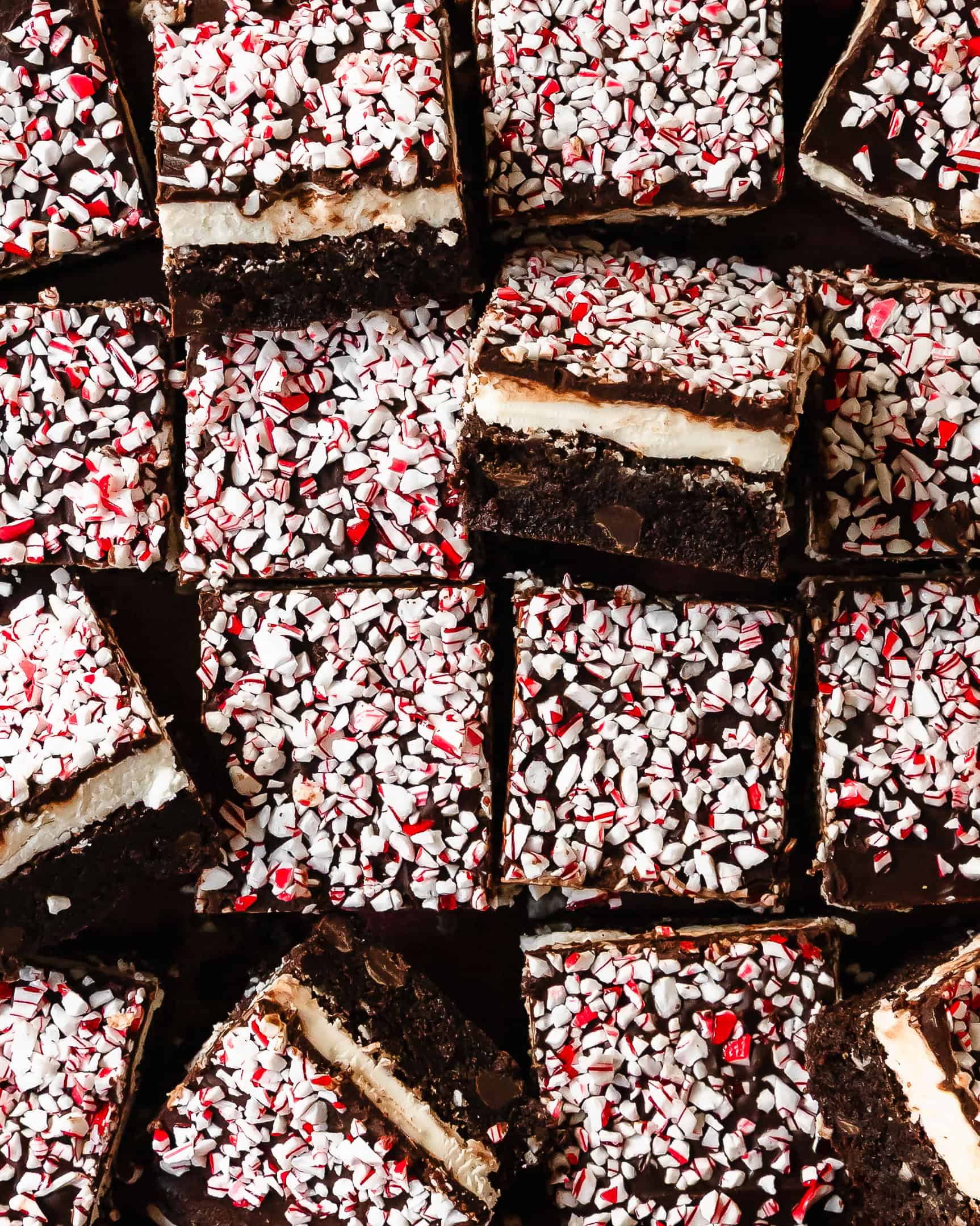 Peppermint brownies are rich and fudgy chocolate brownies filled with sweet peppermint flavor. They’re topped with a layer of creamy peppermint frosting, sweet chocolate glaze and crushed peppermint candy. This peppermint brownie recipe is easy to make and creates the most delicious and decadent holiday brownies.