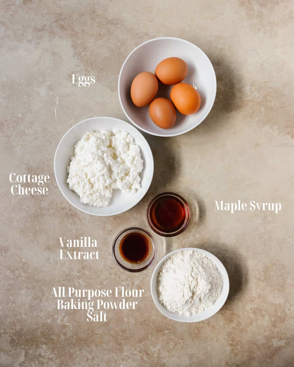 Gather eggs, cottage cheese, maple syrup, vanilla extract, all purpose flour and baking powder.