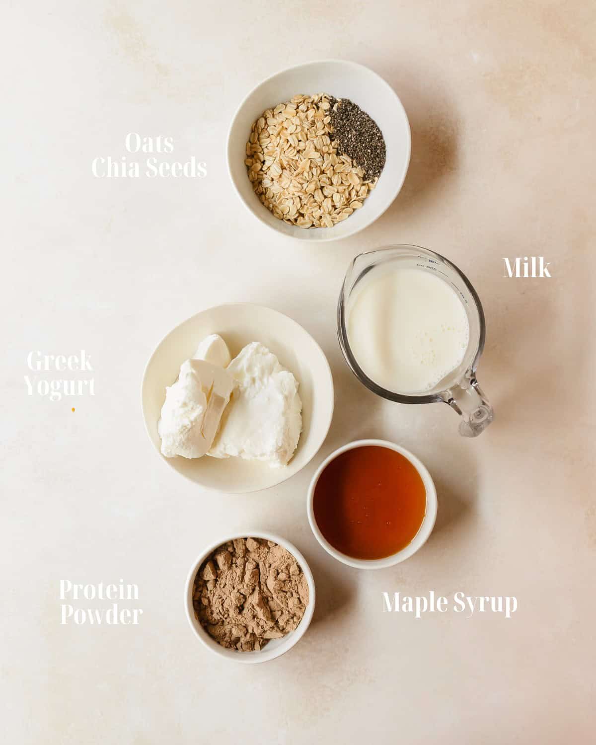 Gather rolled oats, chia seeds, milk, yogurt, protein powder and maple syrup pulse any topping you like.