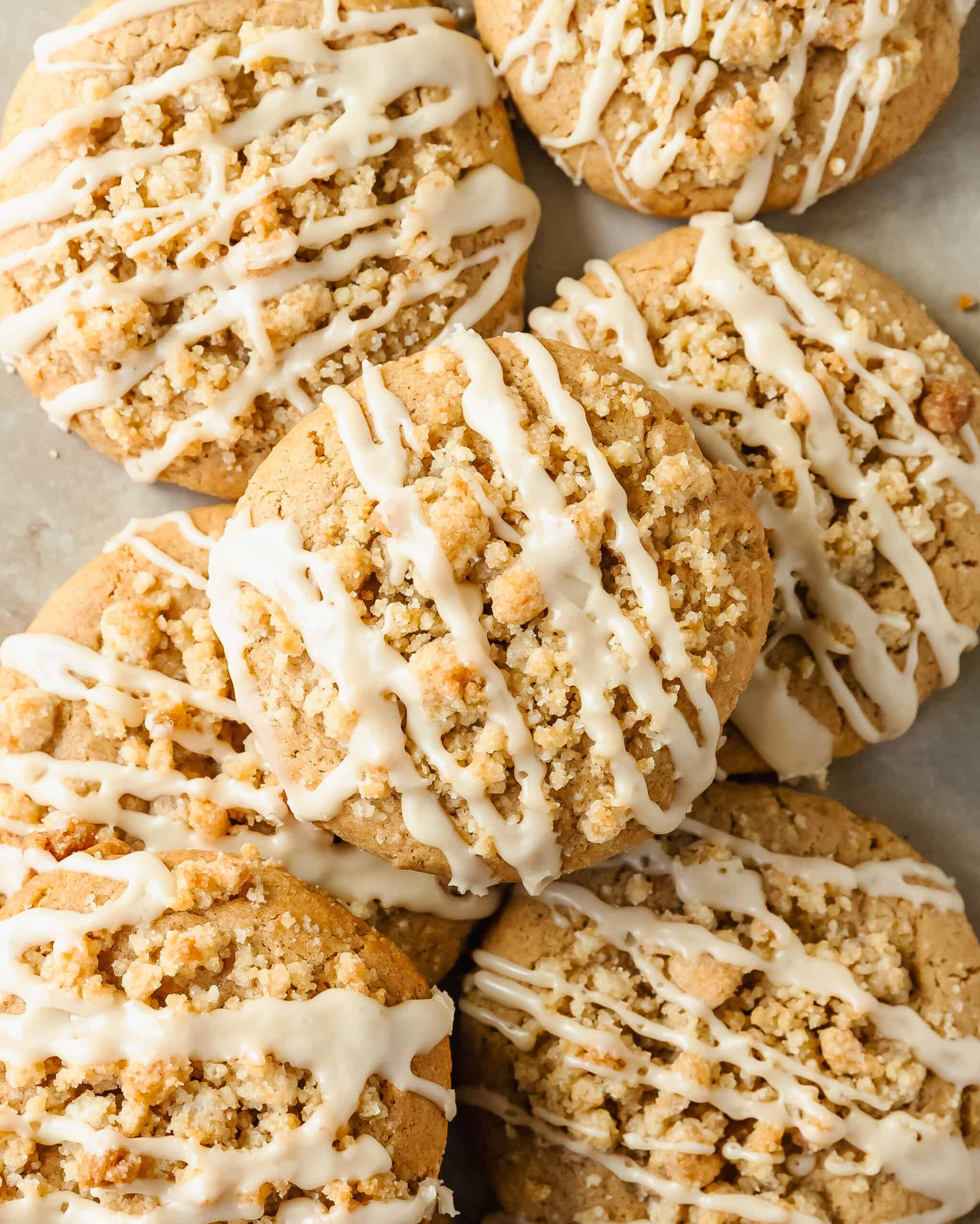 Coffee cake cookies are soft, thick and buttery cinnamon sugar cookies topped with a brown sugar crumb topping and creamy vanilla glaze. This cozy coffee cake cookie recipe is easy to make and requires no chill time.