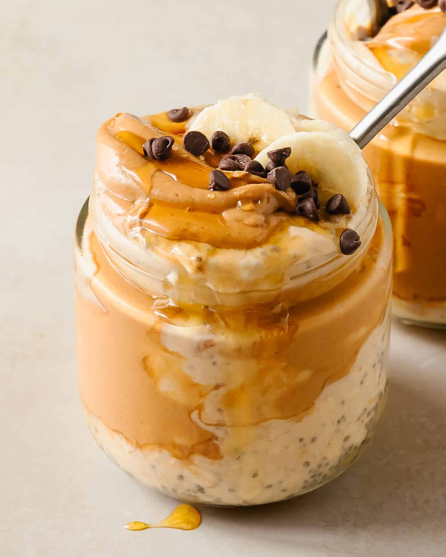 Peanut butter overnight oats is a rich and creamy, make ahead breakfast made by soaking rolled oats overnight in a naturally sweetened, peanut butter infused milk and yogurt mixture. These overnight pb oats take about 5 minutes to make and are perfect for meal prep.