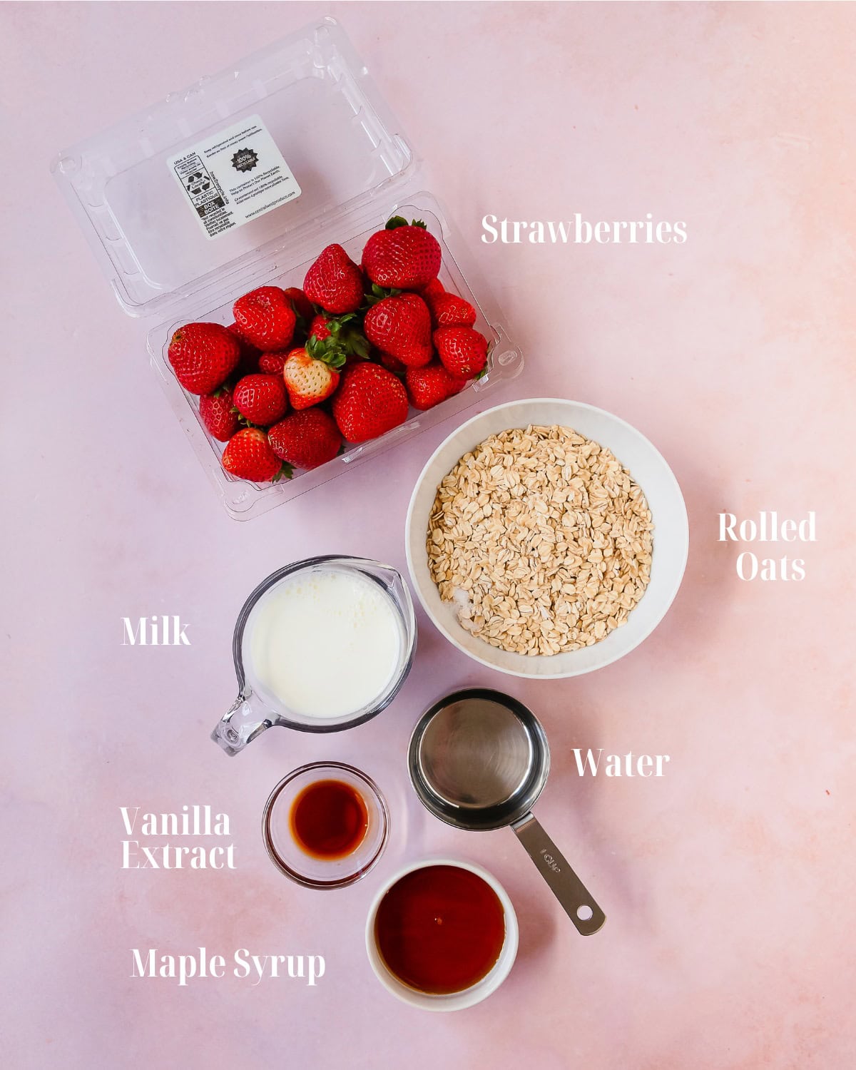 Gather strawberries, milk, water, maple syrup, oats, vanilla extract and salt.