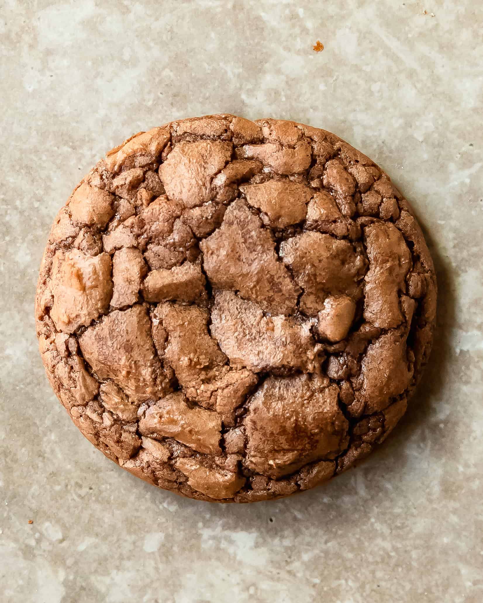 Homemade brownie mix cookies with a soft center, shiny tops, and deep chocolate flavor.