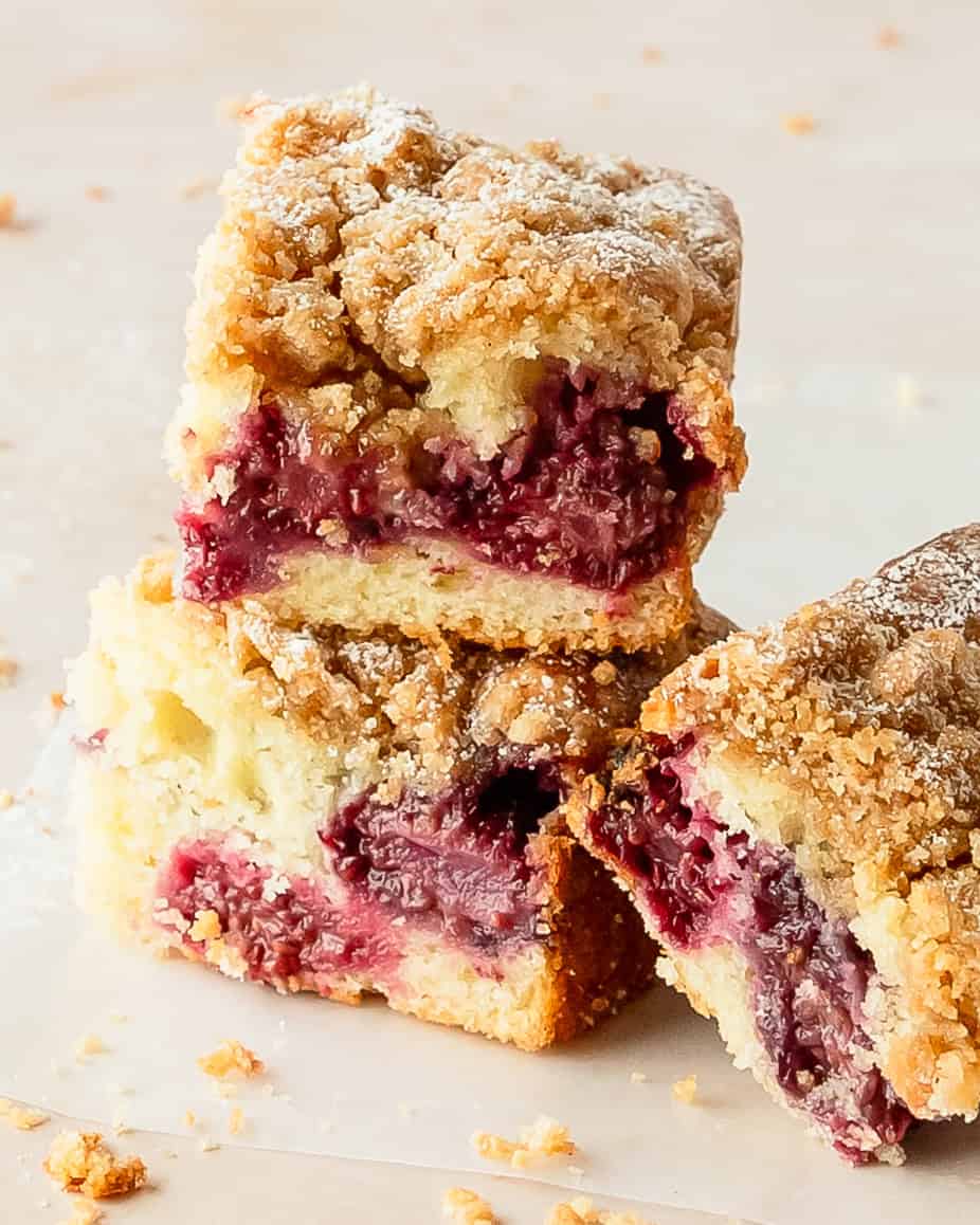 Moist berry coffee cake topped with golden cinnamon crumbs and fresh blackberries.
