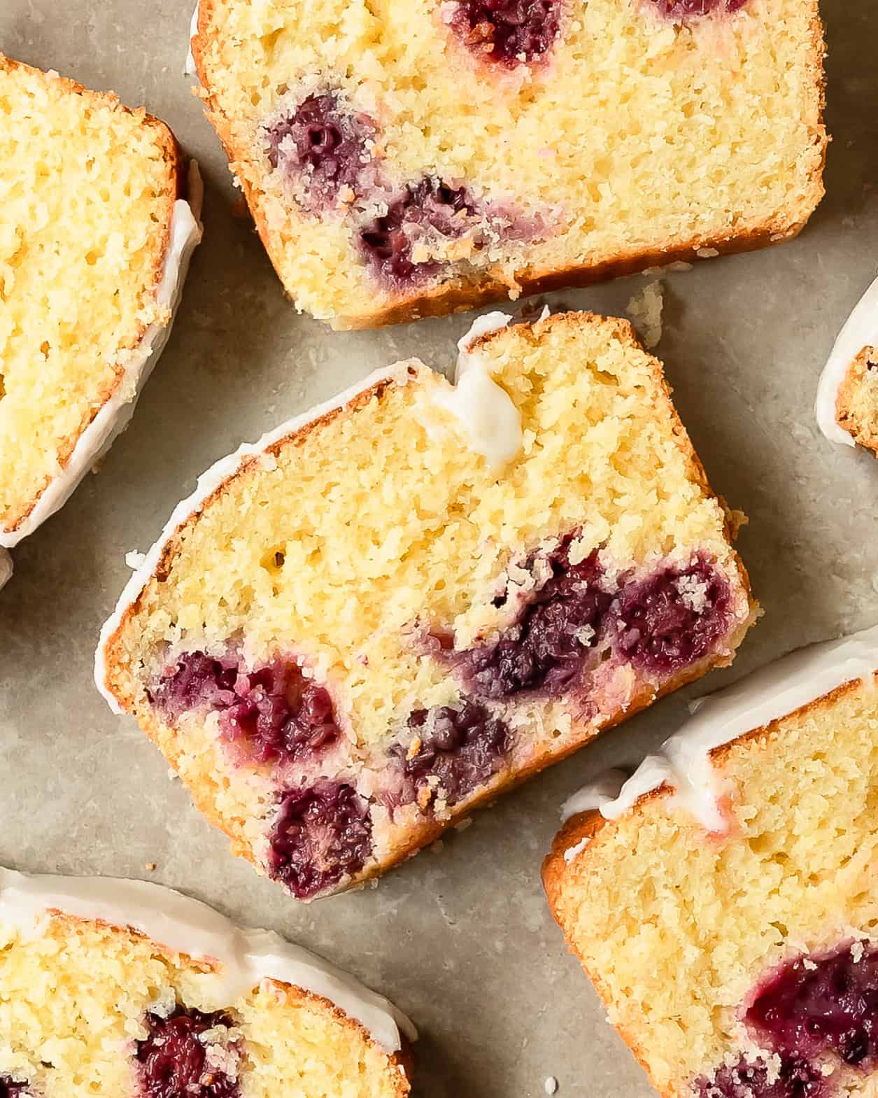 Bakery-style lemon blackberry bread with fresh lemon zest, sweet blackberries, and a smooth lemon glaze.
