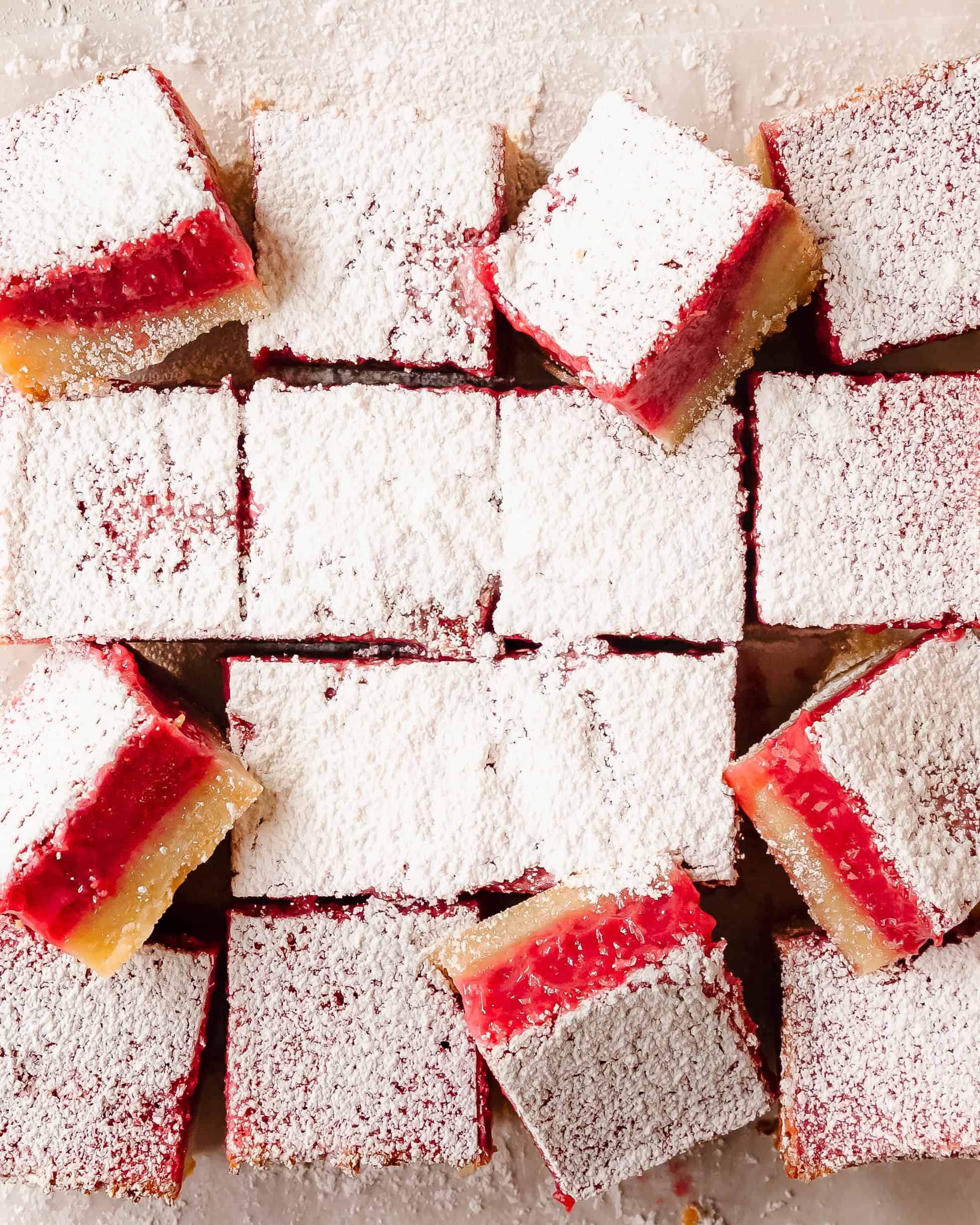 Homemade raspberry lemon bars with buttery shortbread crust, tangy lemon raspberry filling ready to serve.