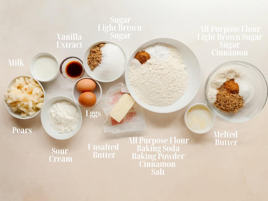 Ingredients to make pear muffins in bowls.