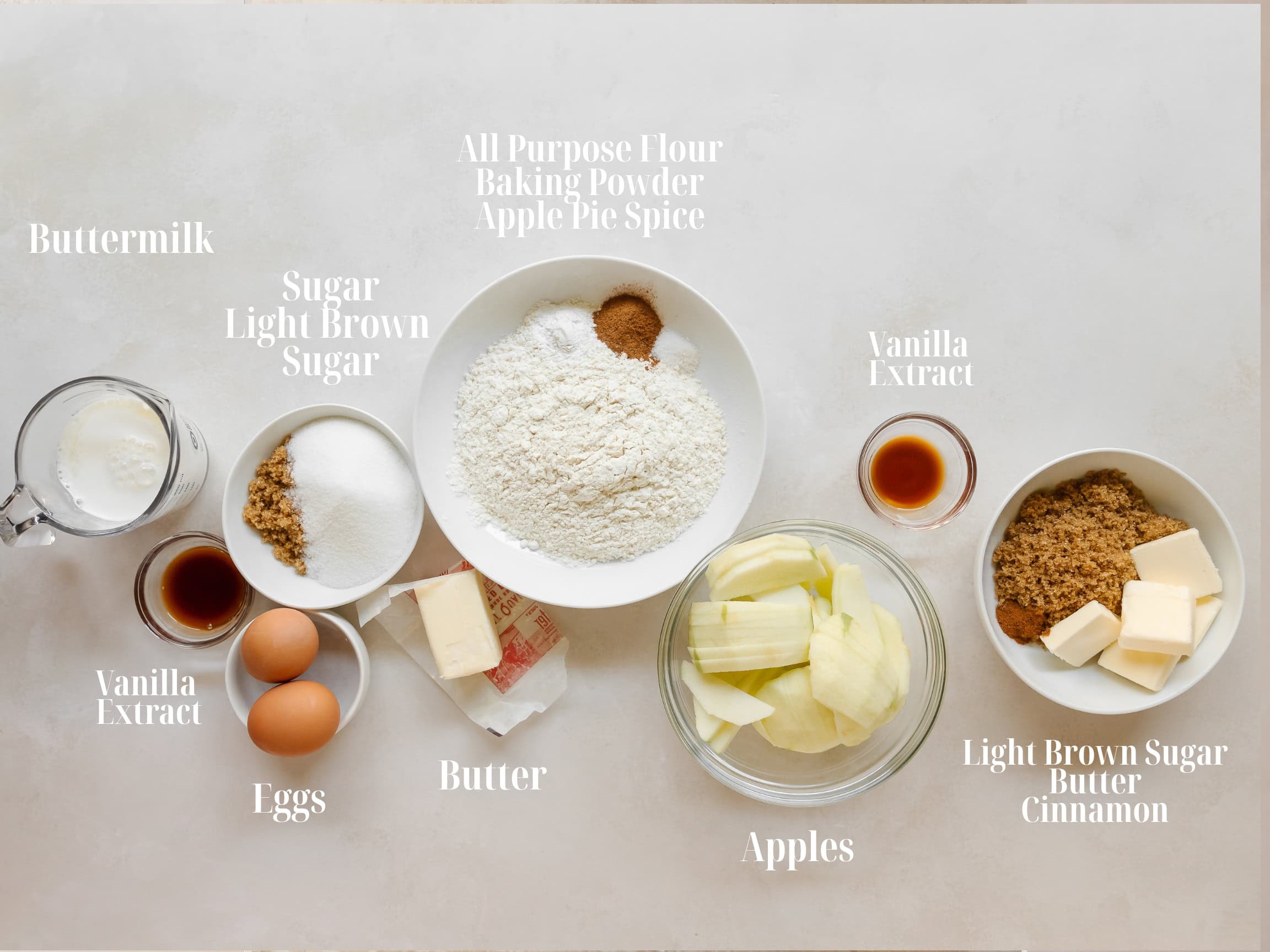Ingredients to make apple upside down cake in bowls.