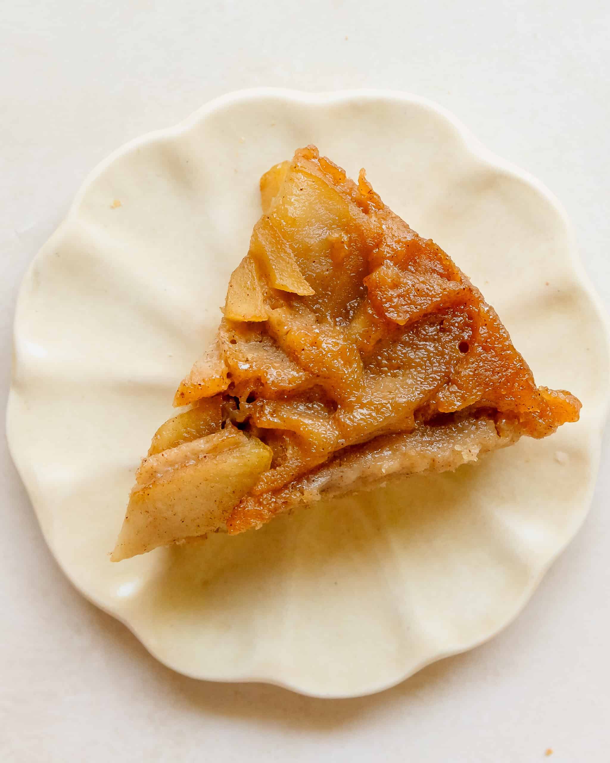 Golden caramelized apple topping on a freshly baked upside down cake.