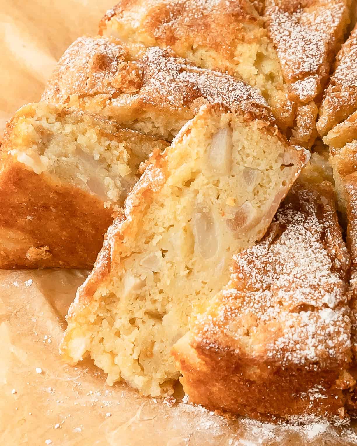 Buttery cake with pears served warm with powdered sugar.