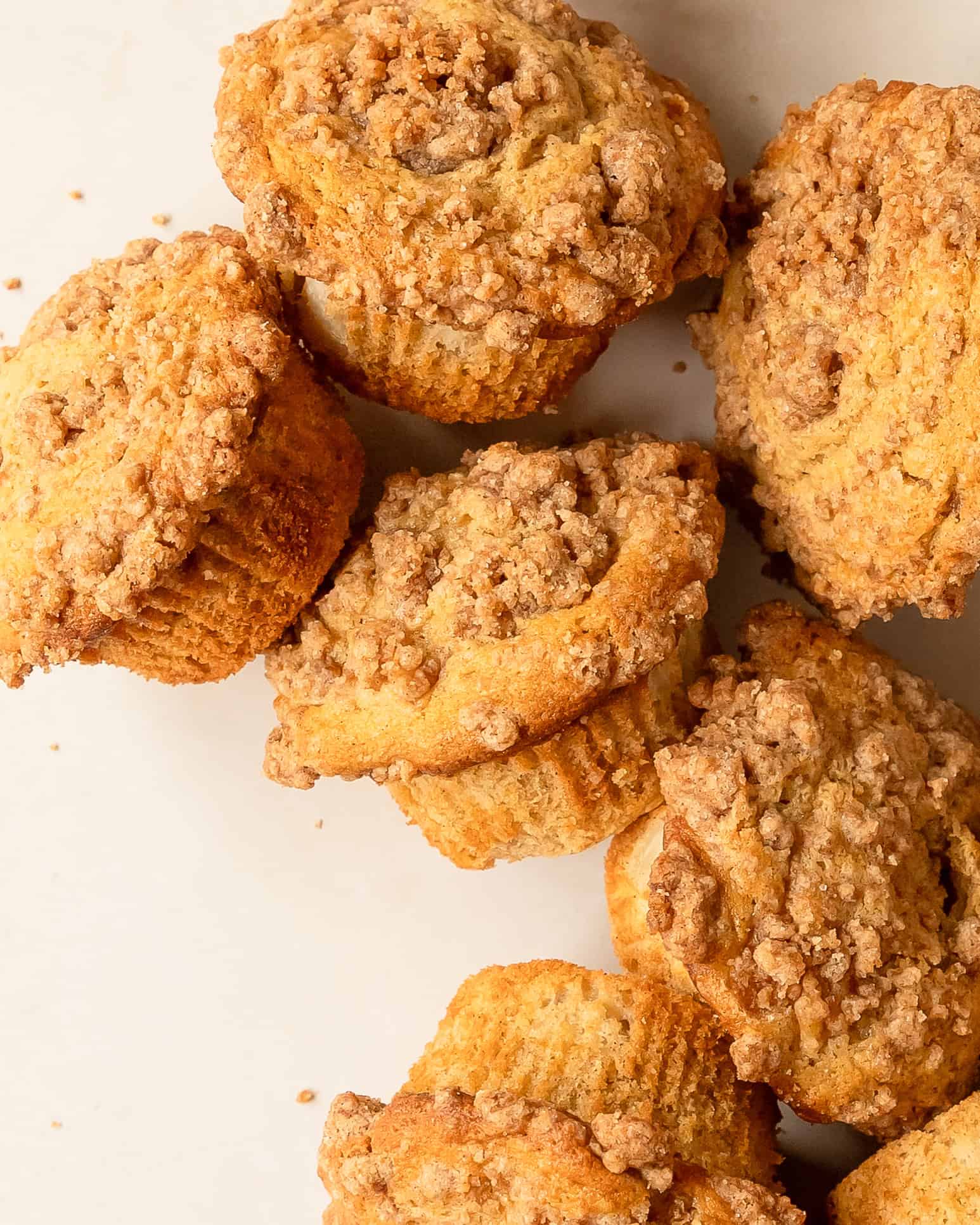 Fresh homemade pear muffins with golden crumble tops.