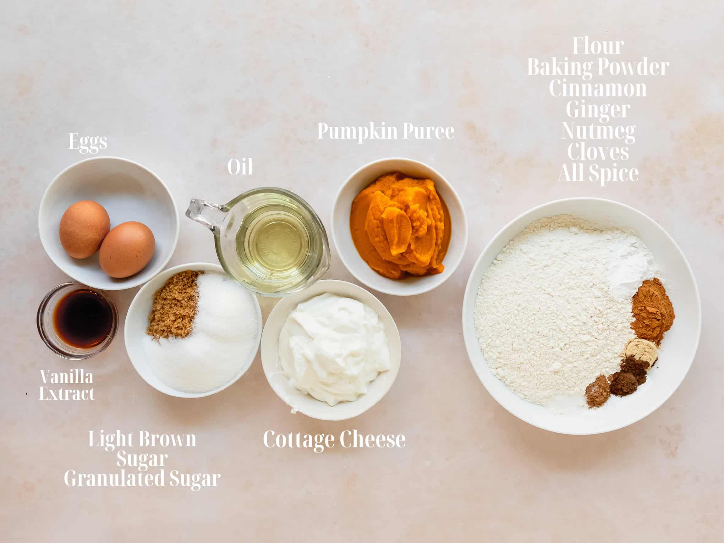 Ingredients to make pumpkin cottage cheese muffins in bowls.