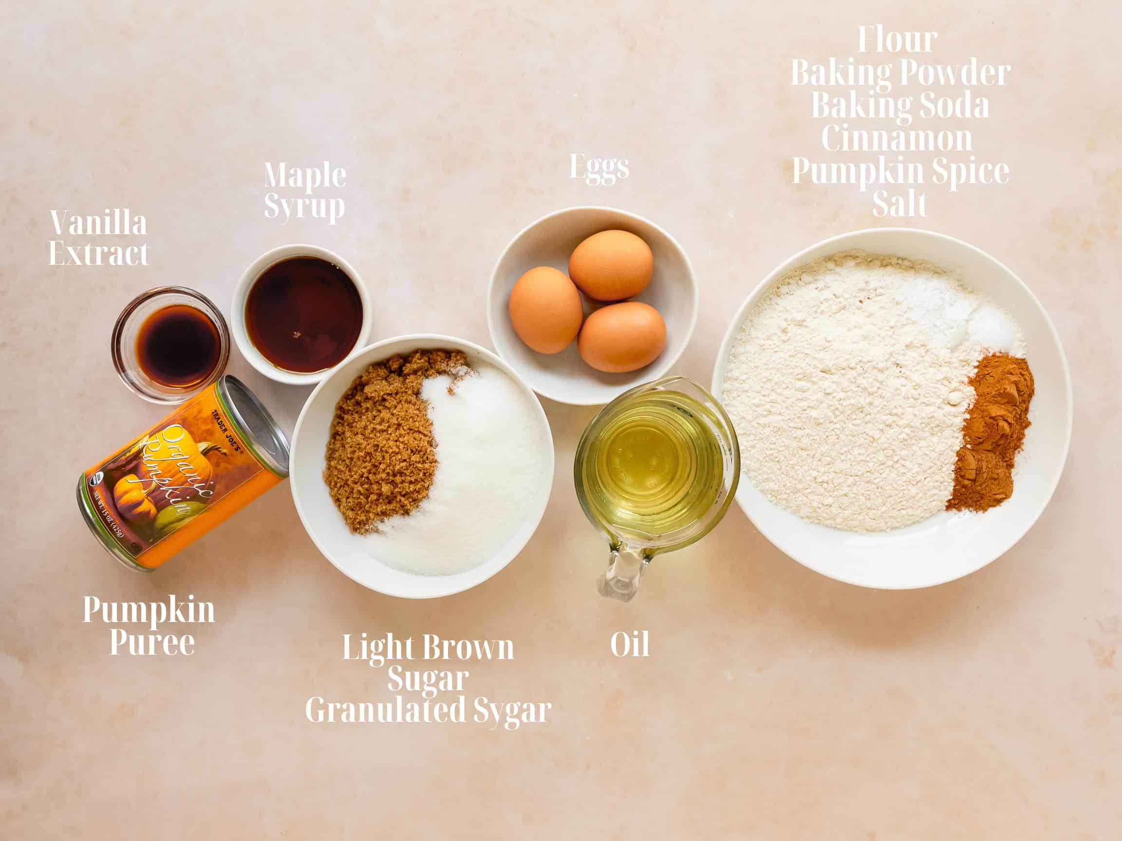 Ingredients to make pumpkin bars in bowls.