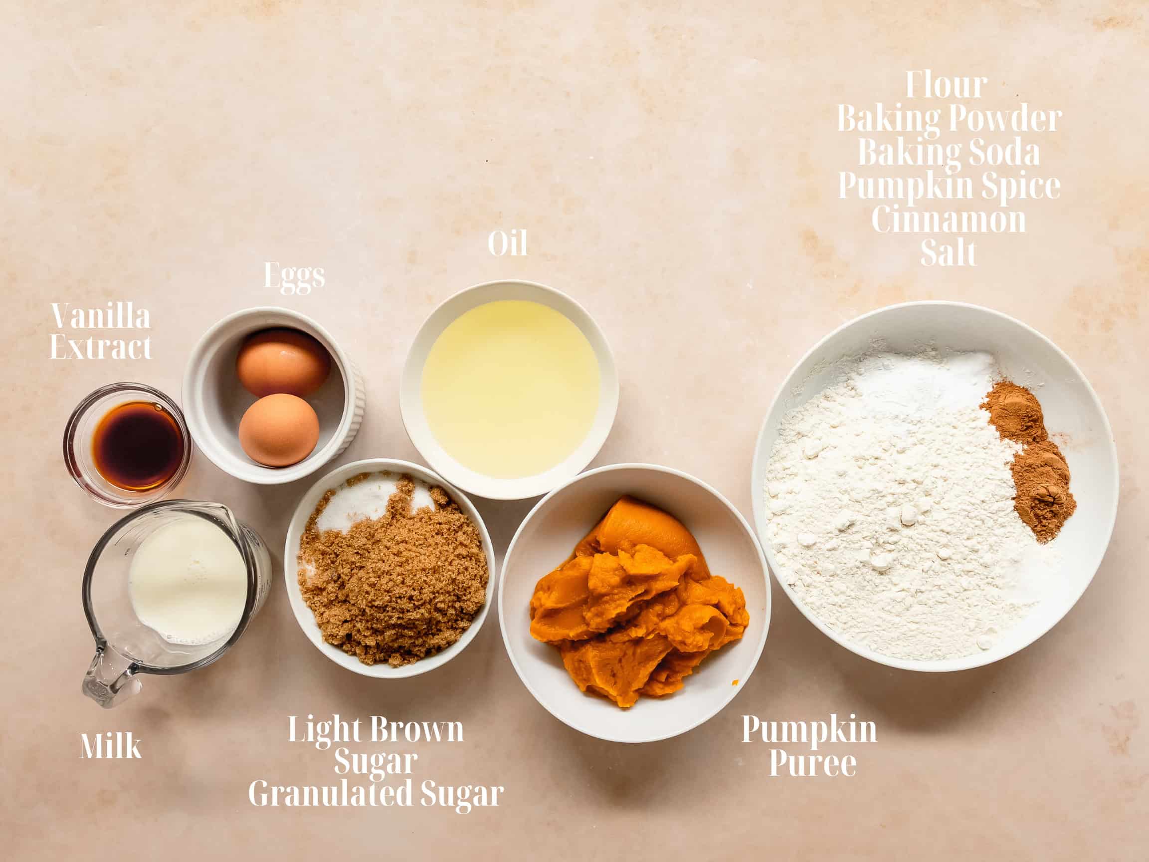 Ingredients to make pumpkin cream cheese muffins in bowls. 