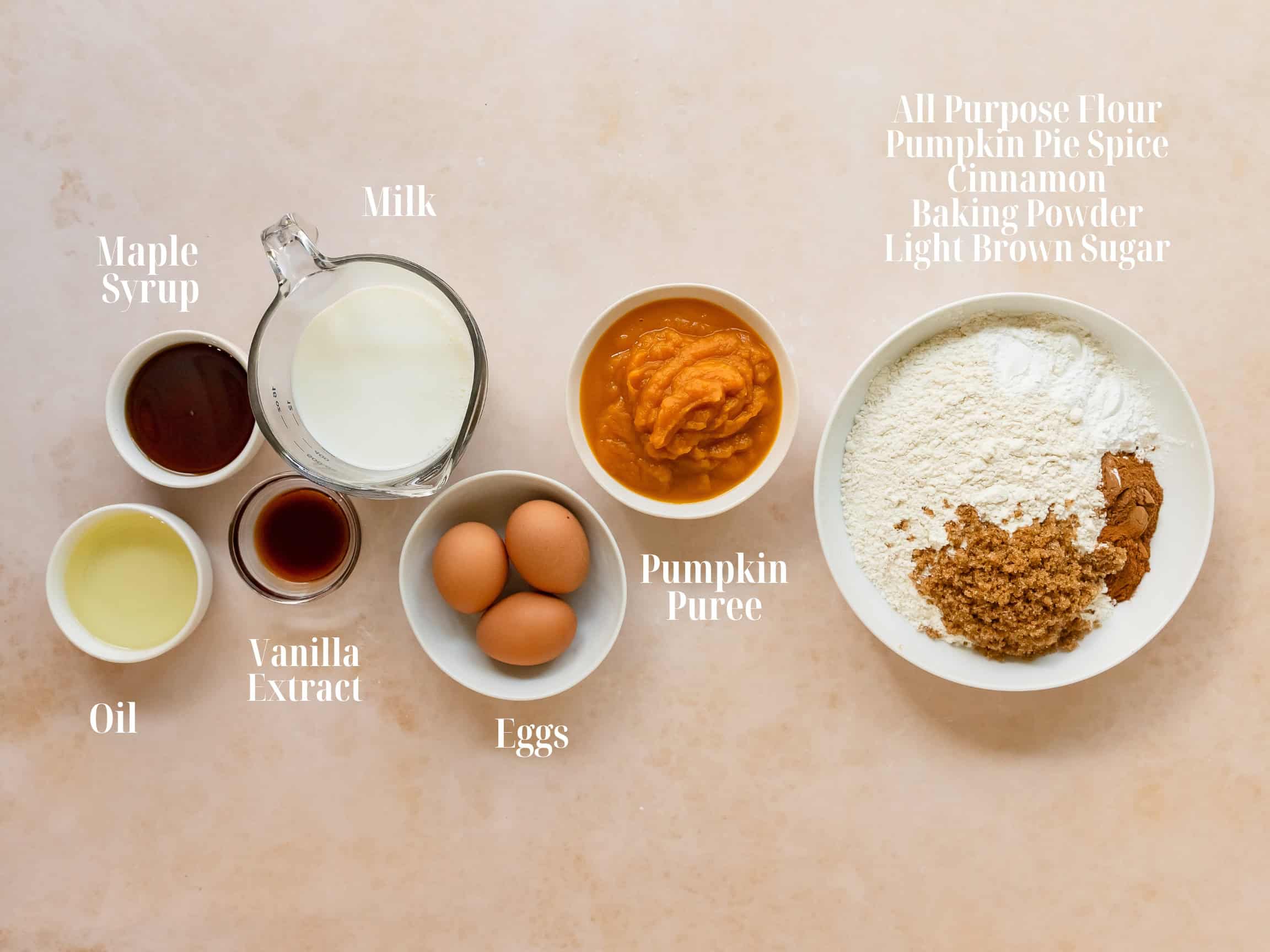 Ingredients to make pumpkin waffles in bowls.
