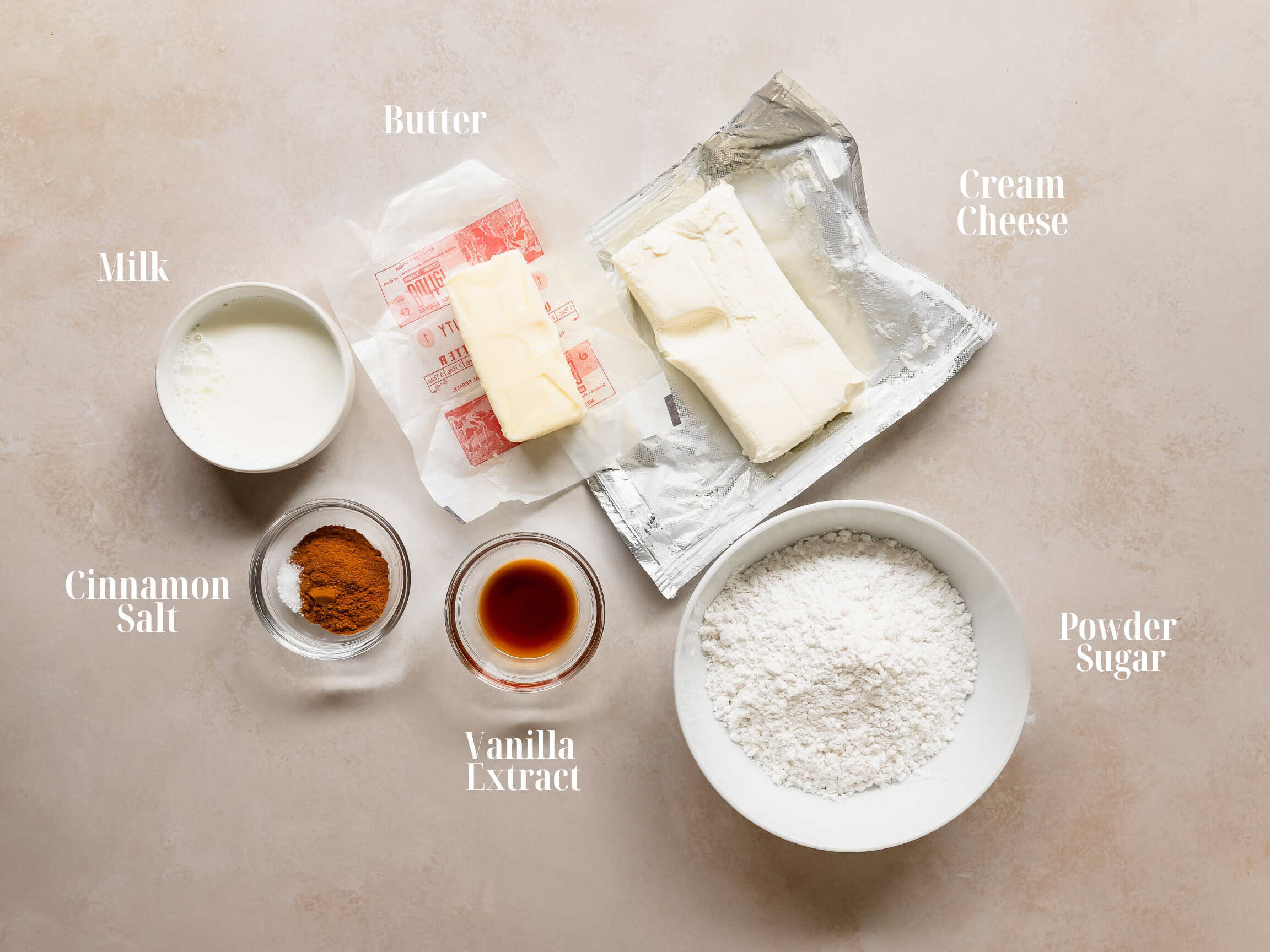 Ingredients to make cinnamon cream cheese frosting.