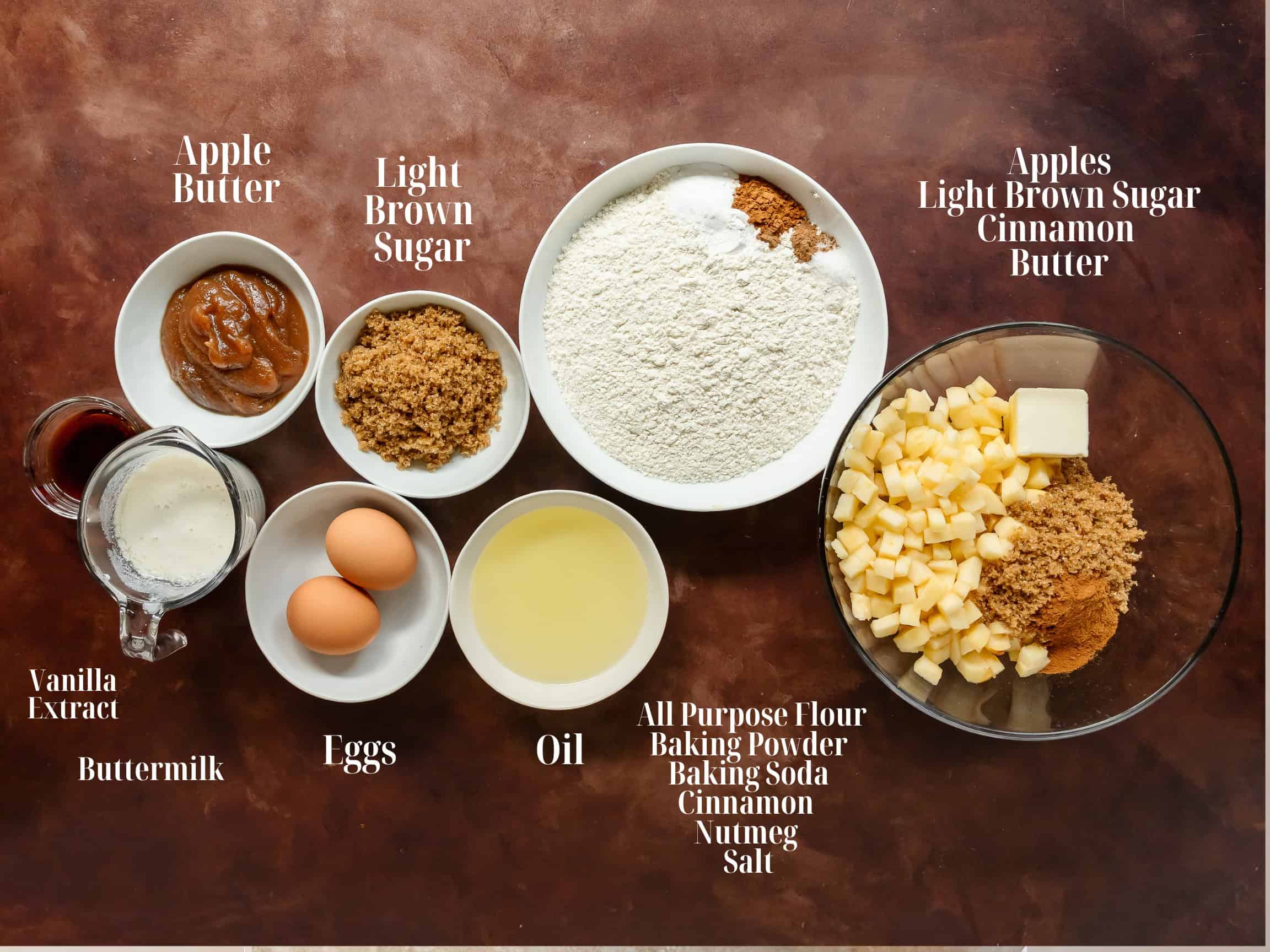 Ingredients to make apple fritter cake in bowls.