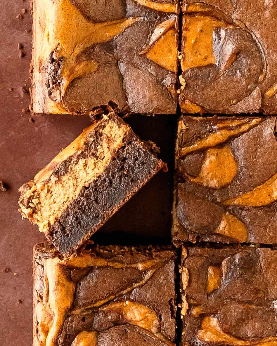 Close-up of rich chocolate pumpkin brownies showing their fudgy centers.