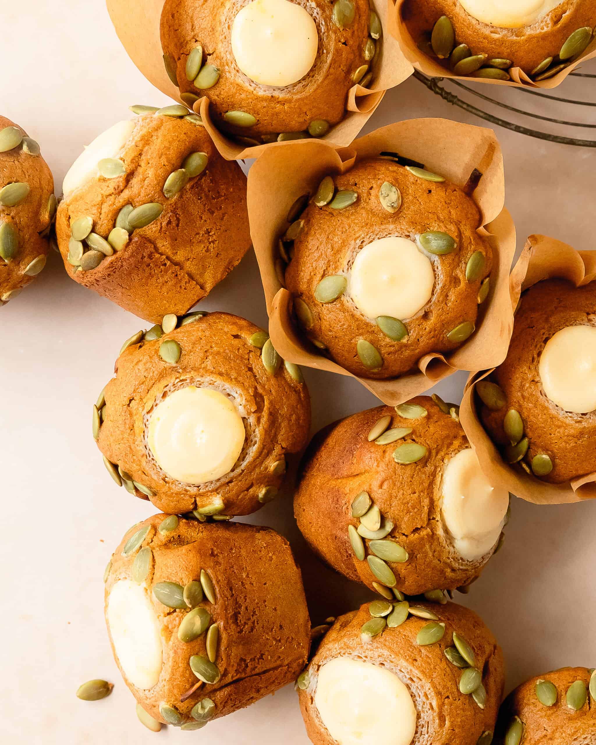Cream cheese pumpkin muffins topped with crunchy pumpkin seeds. 