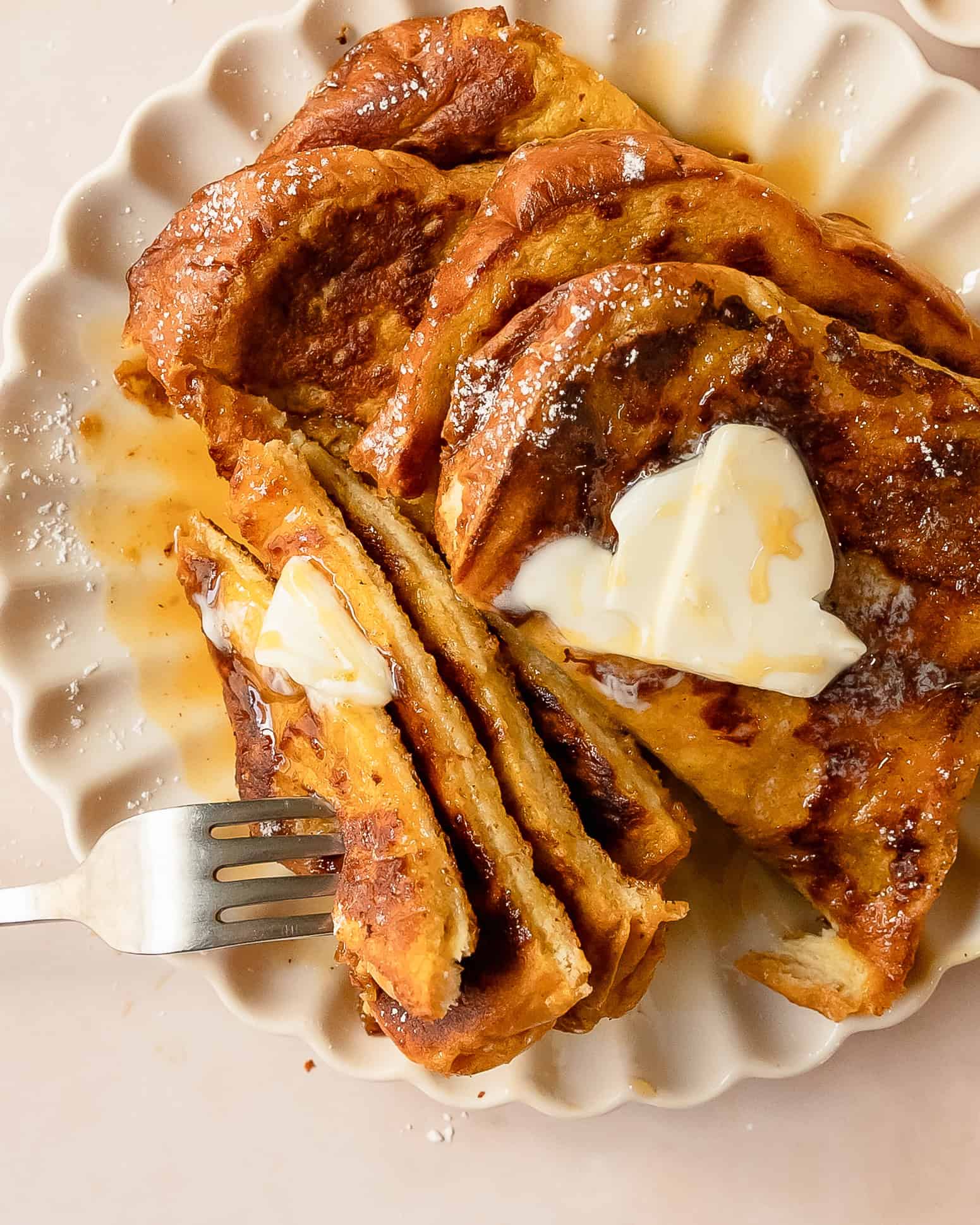 Thick slices of golden pumpkin French toast ready for a cozy fall breakfast.