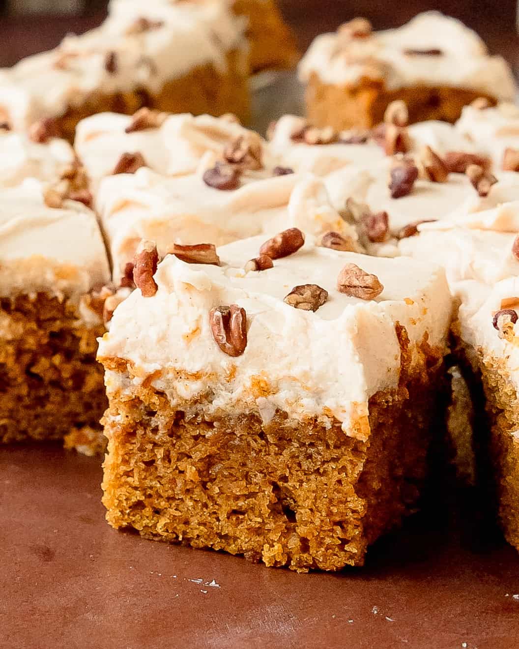 Close-up of moist sweet potato cake with a soft, fluffy texture and cream cheese frosting.